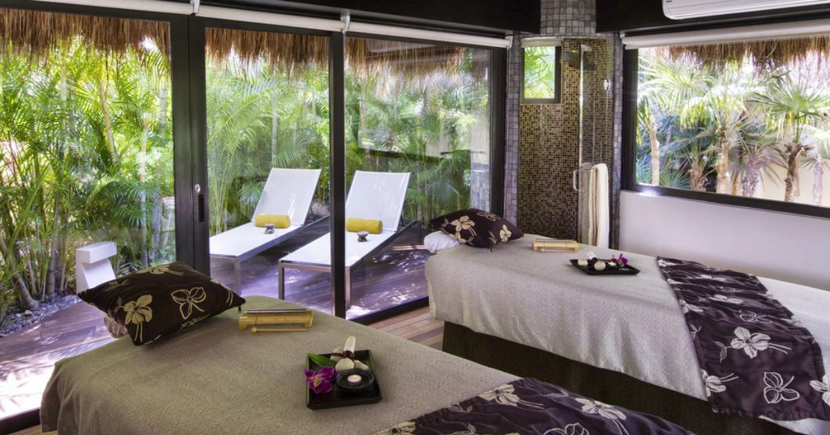 Therapy cabin at The Village Spa, featuring comfortable beds for relaxing wellness treatments.