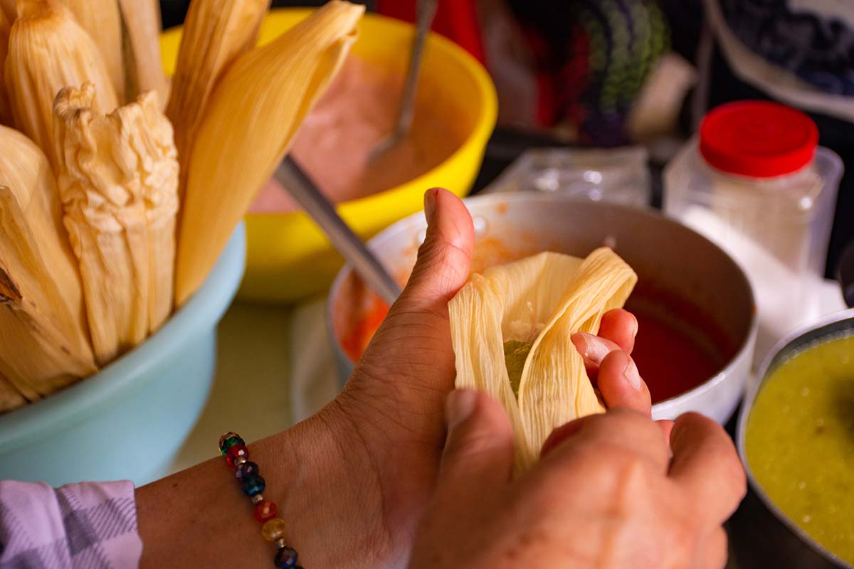 Person preparing tamales