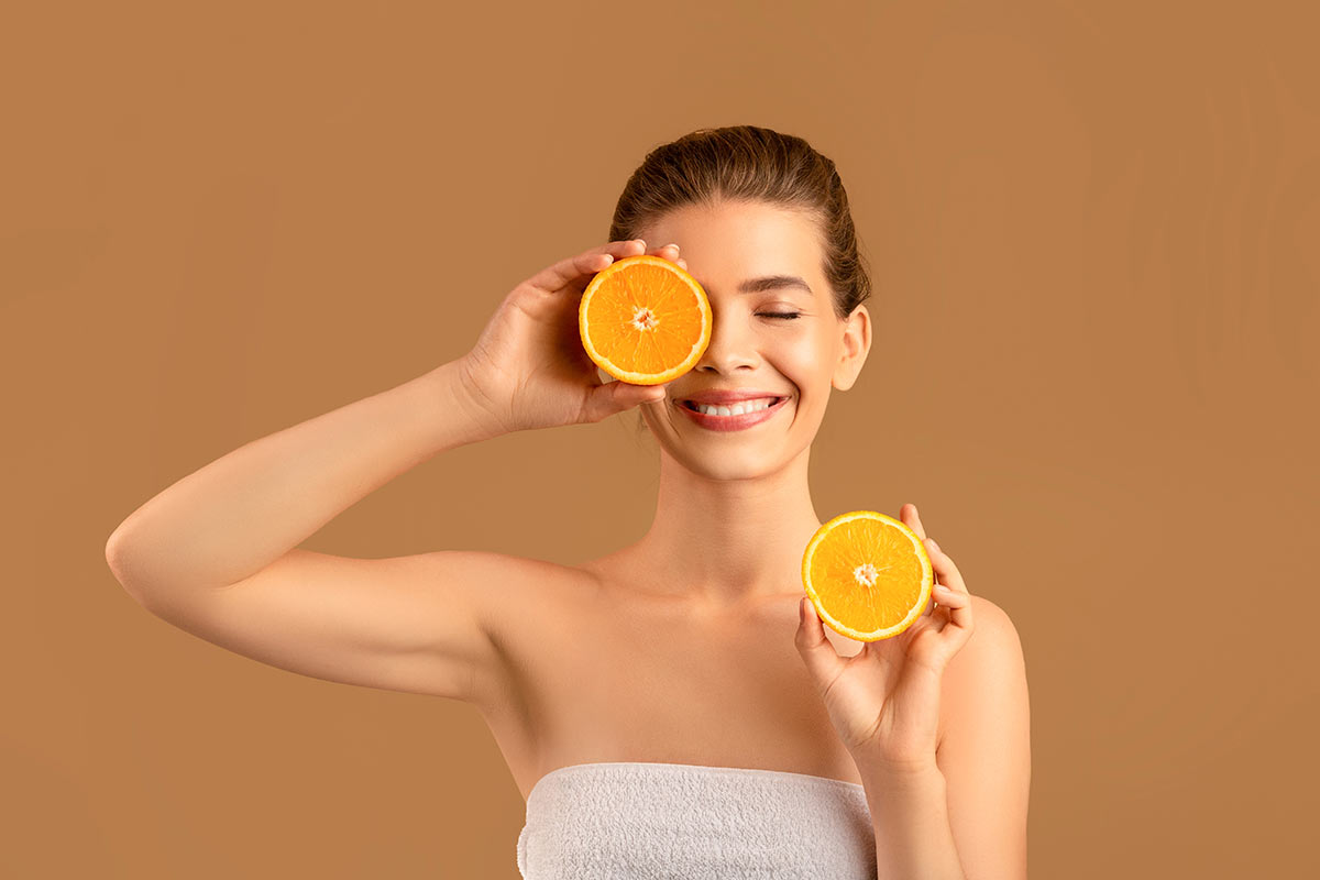 Woman holding oranges 