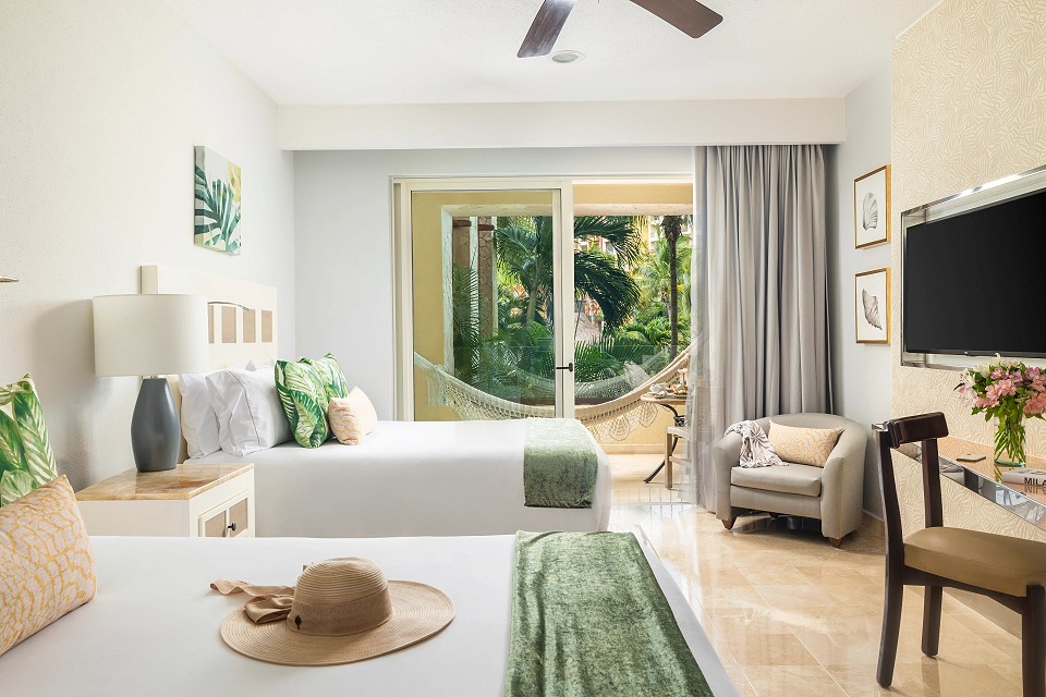 two queen beds with garden view